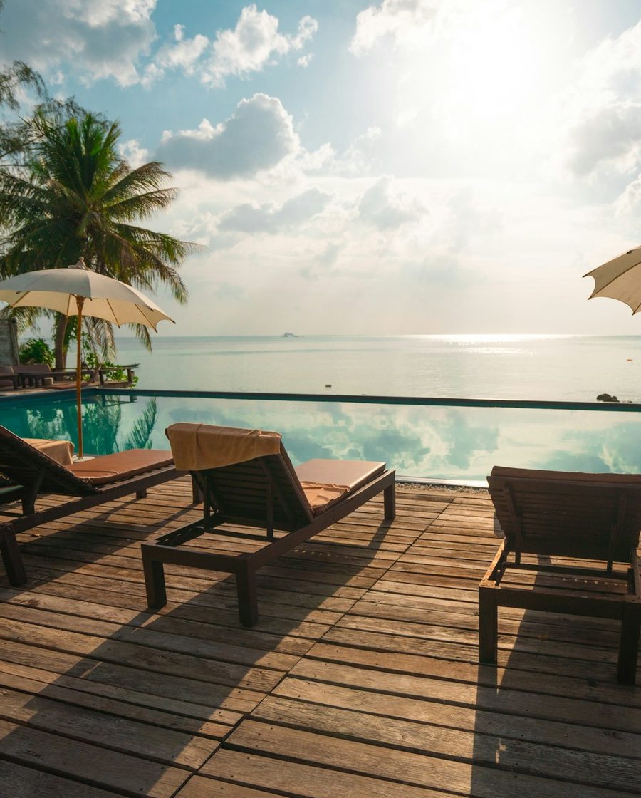 Sun loungers on a terrace overlooking the sea at a boutique resort